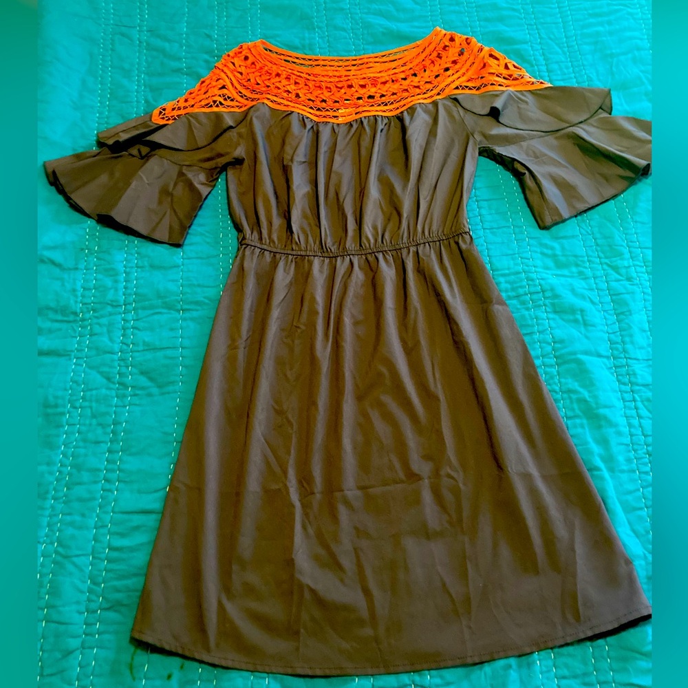 Grey with orange detail.. Super cute and light material!! Open shoulder